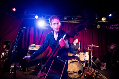 Simon Langhard plays the double bass on stage